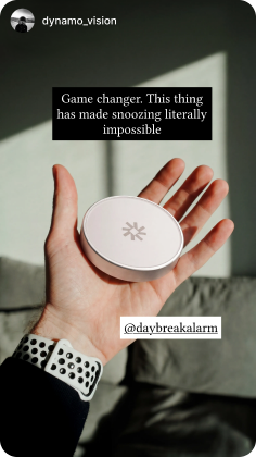 Daybreak dock held in a hand with customer caption